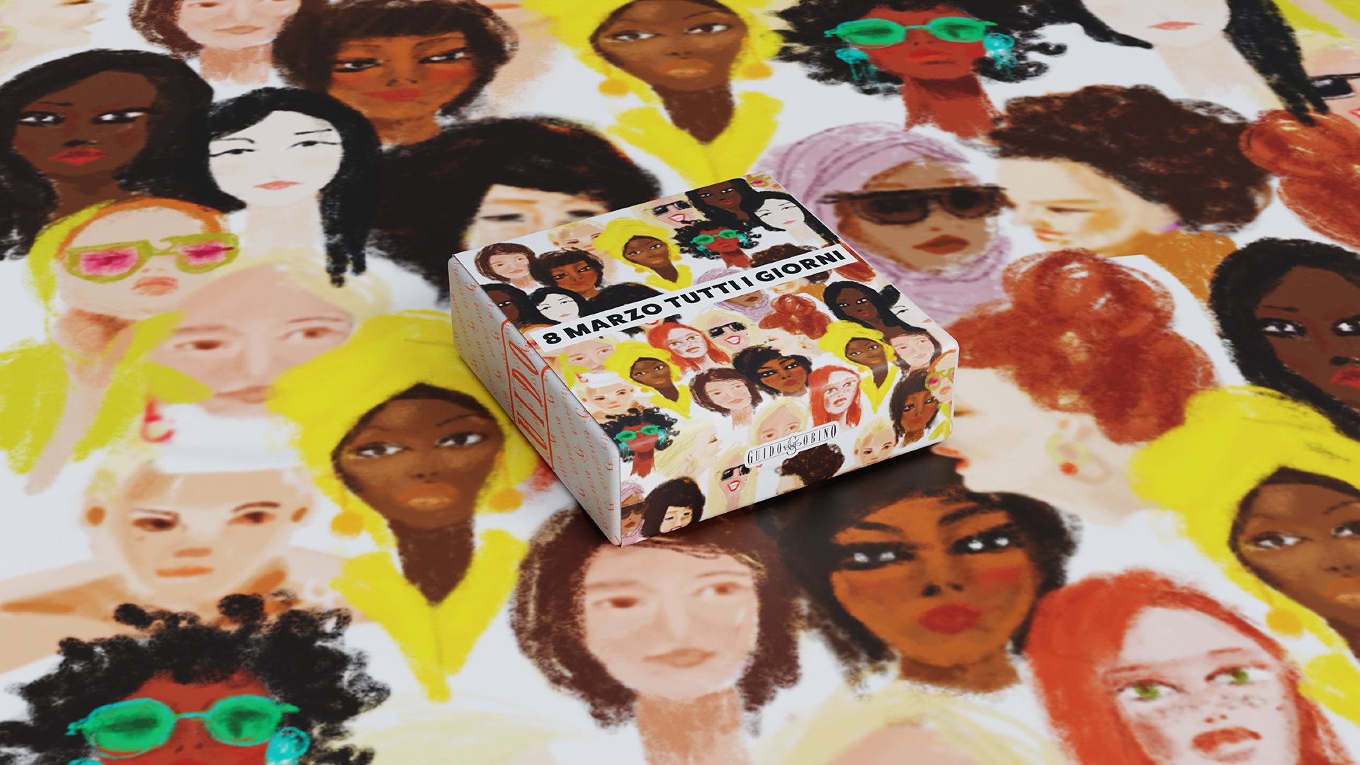Scatola Woman’s Day ambientata su pattern illustrato di volti femminili